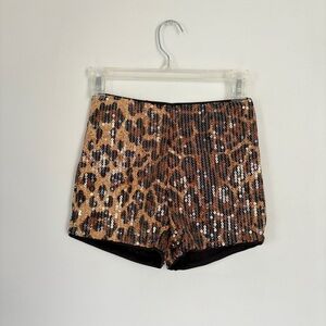 Cheetah print sequin shorts.